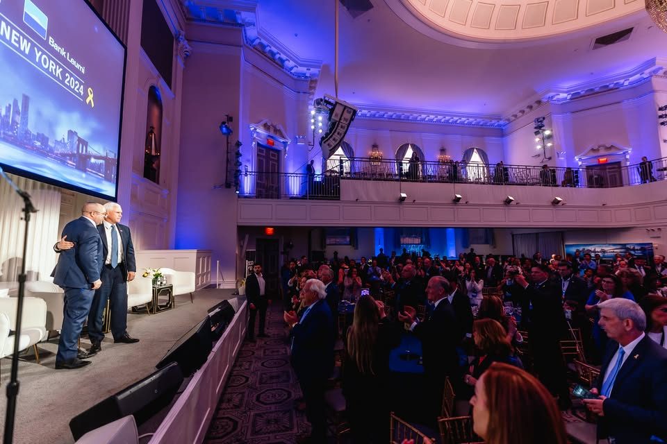 Zvika Klein and Mike Pence on stage before a standing audience at The Jerusalem Post Annual Conference in New York